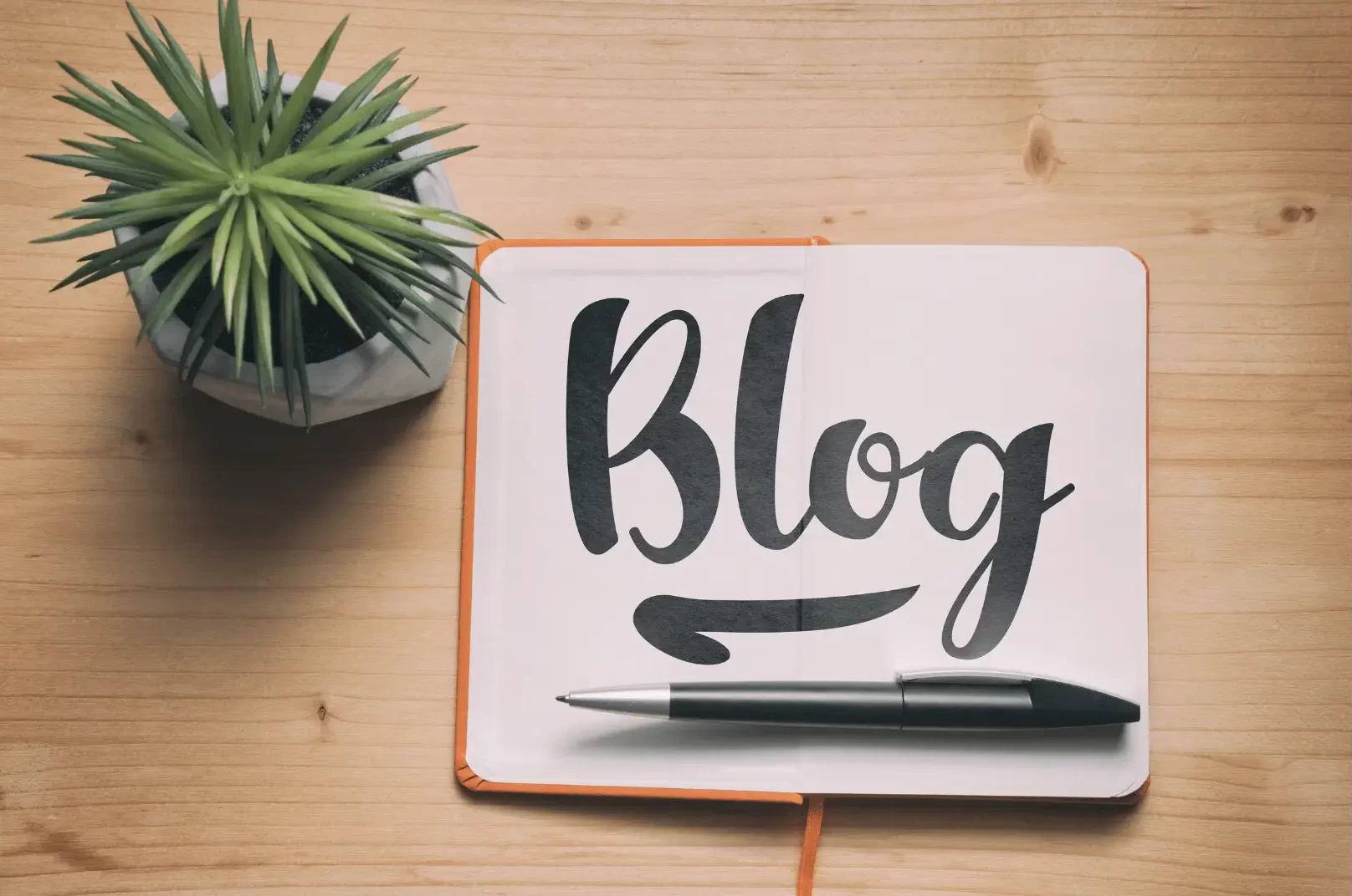 A notebook with the word "blog" on it